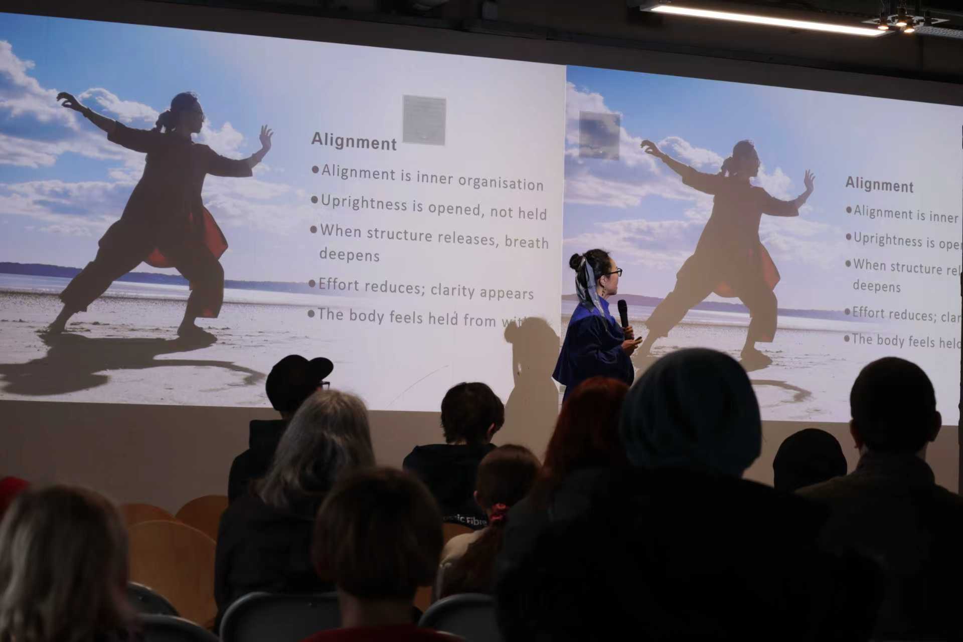 Dr Jar presenting the Tai Chi principle of alignment to an audience