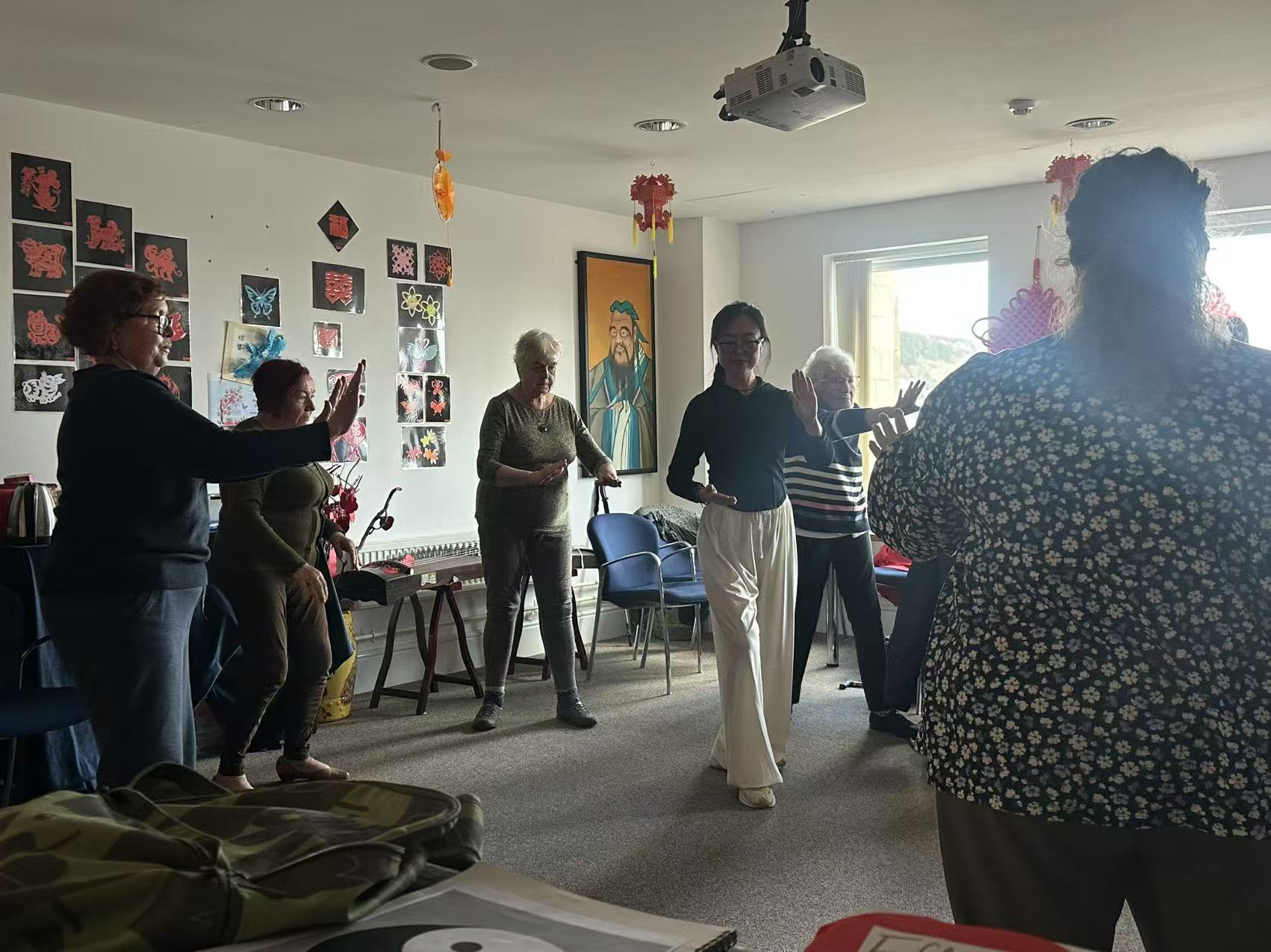 Dr Jar leading a supportive Tai Chi practice for women