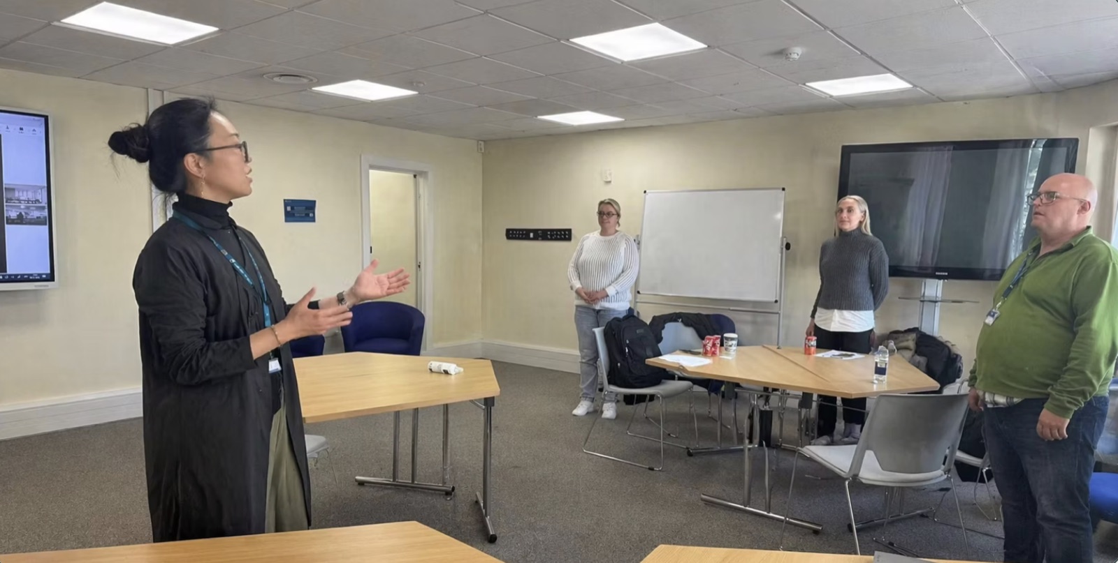 Dr Jar delivering Tai Chi to a small workplace team